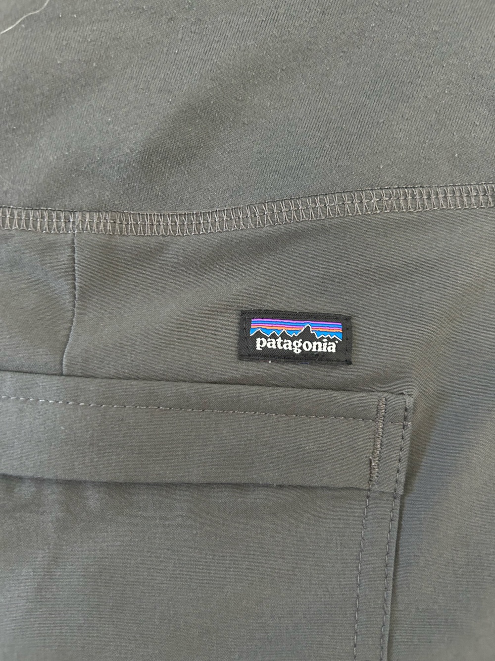 Patagonia charcoal tee with multicolor logo